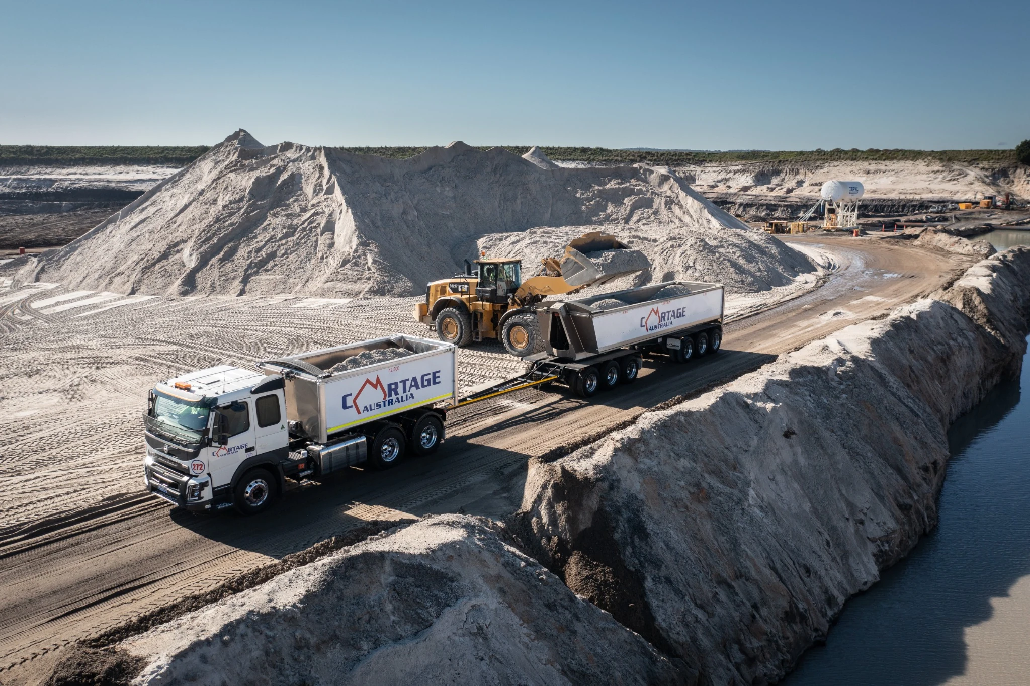 Cartage Australia truck being loaded with sand at a quarry
